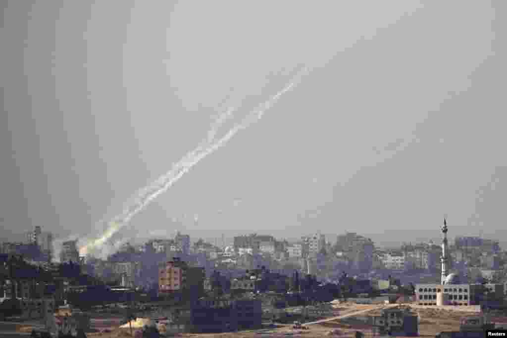 Trails of smoke are seen after the launch of rockets from the northern Gaza strip towards Israel, October 24, 2012.