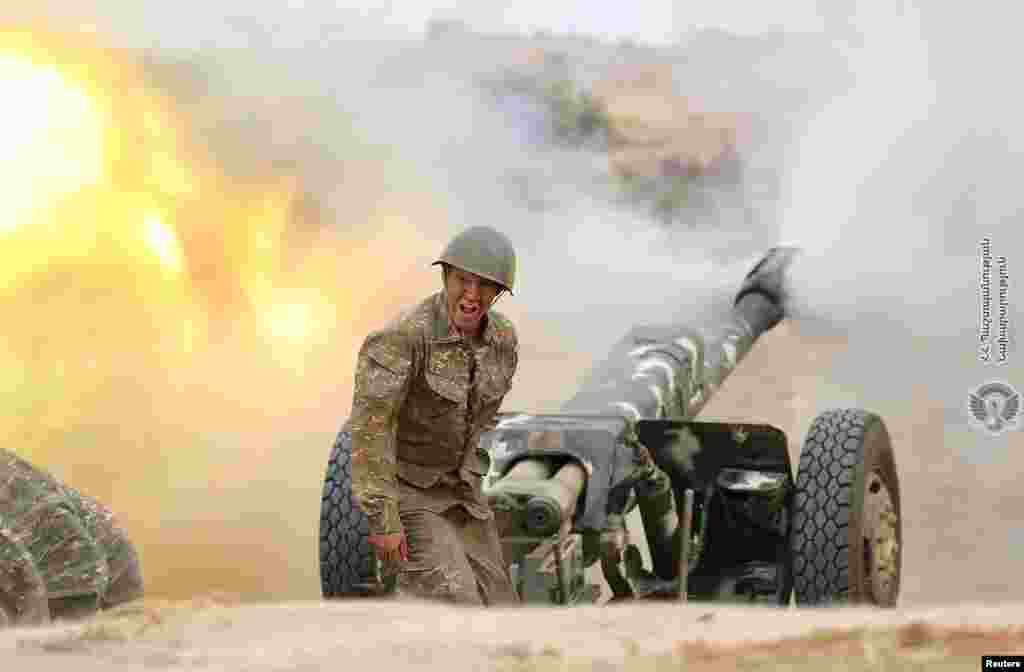 An ethnic Armenian soldier fires an artillery piece during fighting with Azerbaijan&#39;s forces in the breakaway region of Nagorno-Karabakh. (Credit:&nbsp;Defense Ministry of Armenia/Handout)