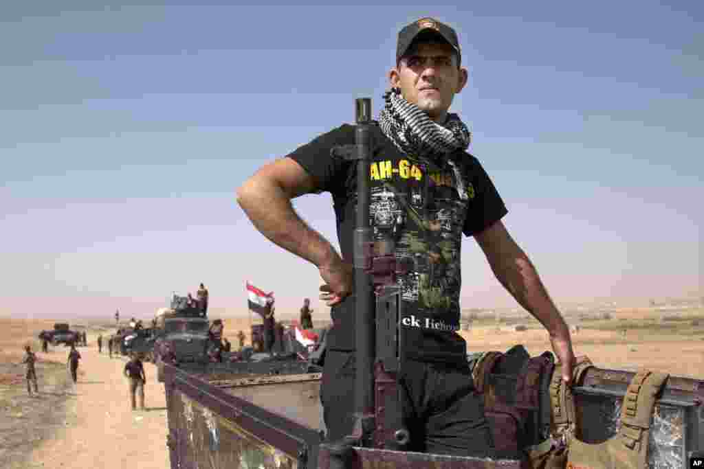 Iraqi special forces soldiers deployed for an offensive to retake Mosul from Islamic State militants prepare to move out from a camp near Khazer, Iraq, Oct. 14, 2016.