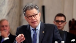 FILE - Senate Judiciary Committee member Senator Al Franken, D-Minn. questions Attorney General-designate, Senator Jeff Sessions, R-Ala., on Capitol Hill in Washington, Jan. 10, 2017, during the committee's confirmation hearing for Sessions.