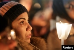 A woman becomes emotional during a vigil in support of the Muslim community in Montreal, Quebec, Jan. 30, 2017.