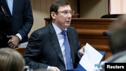 FILE - Ukraine's Prosecutor General Yuriy Lutsenko attends a trial in Kyiv, Nov. 28, 2016. 