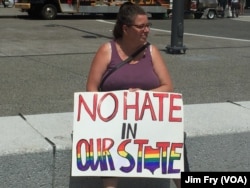 Nancy Ballou of Cleveland said she opposes the presumptive Republican presidential nominee Donald Trump, citing what she called his xenophic, racist and anti-woman message, in the Public Square in downtown Cleveland, July 18, 2016.