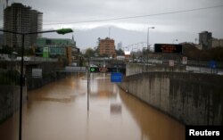 FILE - A view of a flooded highway access in Santiago, Chile, April 17, 2016.