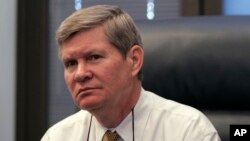 FILE - Sen. Tim Johnson, D-S.D., in his office on Capitol Hill in Washington.