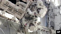 STS-134 Mission Specialists Andrew Feustel and Mike Fincke participate in the mission's third spacewalk as construction and maintenance continue on the International Space Station, May 25, 2011
