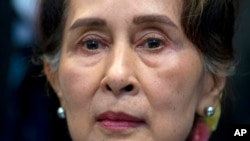 FILE: The deposed Myanmar leader Aung San Suu Kyi - pictured here in a photograph taken on Dec. 11, 2019 - was convicted on Wednesday of one of several corruption charges brought against her by the military junta that overthrew her civilian government last year.  