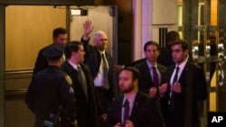  Vice President-elect Mike Pence (top center) leaves the Richard Rodgers Theatre after a performance of "Hamilton" in New York, Nov. 18, 2016. 