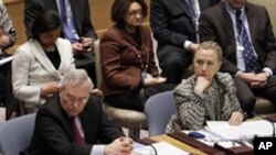 Diplomacy in Action: U.S. Secretary of State Hillary Rodham Clinton, right, listens as British Foreign Minister William Hague, left, addresses a Security Council meeting at United Nations headquarters.