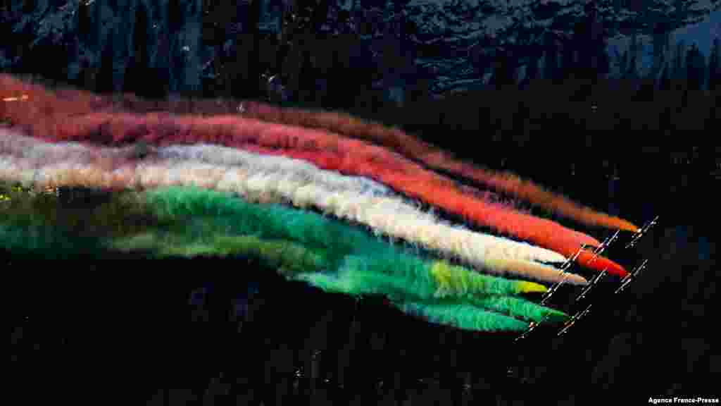 Planes of the Italian Air Force aerobatic unit Frecce Tricolori (Tricolor Arrows) perform over Alta Badia, Dolomite Alps, during the men&#39;s FIS Ski World Cup Giant Slalom event.