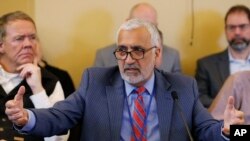 FILE - Salt Lake County District Attorney Sim Gill speaks to the members of the Senate Judiciary, Law Enforcement and Criminal Justice Standing Committee at the Utah state Capitol in Salt Lake City, Feb. 21, 2019. 