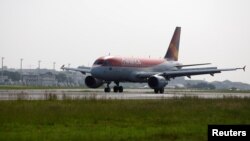 FILE - An Avianca Brasil Airbus A319-100 plane ands at Santos Dumont Airport in Rio de Janeiro, Brazil, June 6, 2016. 