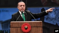 Turkey's President Recep Tayyip Erdogan addresses health sector workers in Ankara, Turkey, March 14, 2017. Angered by recent moves by Germany and the Netherlands to restrict rallies in his support by Turkish emigres, Erdogan said Wednesday that a "Turkophobia" in running rampant in Europe.