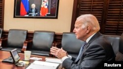 U.S. President Joe Biden holds virtual talks with Russia's President Vladimir Putin amid Western fears that Moscow plans to attack Ukraine, during a secure video call from the Situation Room at the White House, Dec. 7, 2021.