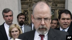 FILE - John Durham speaks to reporters on the steps of U.S. District Court in New Haven, Conn., April 25, 2006.