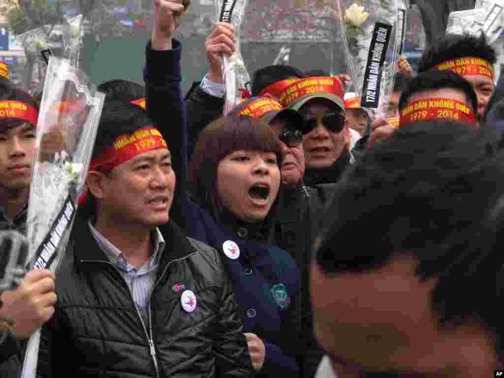 Anti-China protestors rally in the Vietnamese capital Sunday, Feb. 16, 2014 to mark the 35th anniversary of a border war between Vietnam and China.