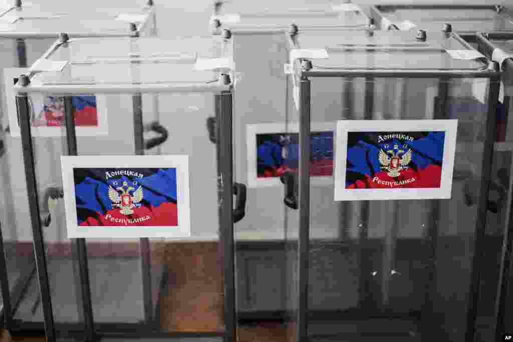 Ballot boxes bearing the flag of Donetsk People's Republic are seen at a polling station, in preparation for the upcoming referendum in Donetsk, Ukraine, May 10, 2014. 