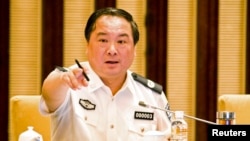 FILE - Then vice minister of public security Li Dongsheng gestures as he speaks during a meeting in Nanjing, Jiangsu province.