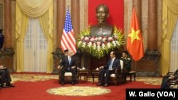 U.S. Defense Secretary Jim Mattis chats with Vietnamese President Tran Dai Quang at the presidential palace in Hanoi, Vietnam, Jan. 25, 2018.