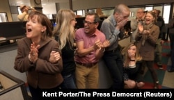 The staff of the Press Democrat, L-R: reporters Randi Rossmann, Julie Johnson, Martin Espinoza, JD Morris, Christi Warren, and Mary Callahan, celebrate winning the Pulitzer Prize for Breaking News Reporting for the coverage of the October fires in Sonoma County in the newsroom in Santa Rosa, California, April 16, 2018.
