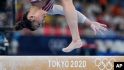 Sunisa Lee, of the United States, starts off on the right foot to win the all-around final at the 2020 Summer Olympics on July 29, 2021, in Tokyo. (AP Photo/Natacha Pisarenko)