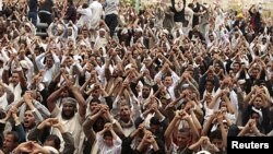 Anti-government protesters shout slogans during a rally after Friday prayers to demand the ouster of Yemen's President Ali Abdullah Saleh in Sana'a, June 24, 2011.
