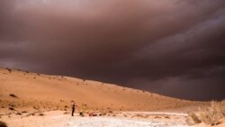 In this undated photo provided by the Palaeodeserts Project in September 2021, a storm arrives during an archaeological excavation of the remains of an ancient lake in northern Saudi Arabia, where ancient humans lived alongside animals such as hippos. (Klint Janulis/Palaeodeserts Project via AP)