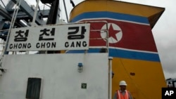 Panamanian presidential security walks on the deck aboard a North Korean-flagged ship at the Manzanillo International container terminal on the coast of Colon City, Panama, July 16, 2013. 