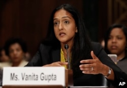 FILE - Vanita Gupta, incoming president and CEO of The Leadership Conference for Civil and Human Rights, testifies on Capitol Hill in Washington, May 2, 2017, before a Senate Judiciary Committee hearing on responses to the increase in religious hate crimes.