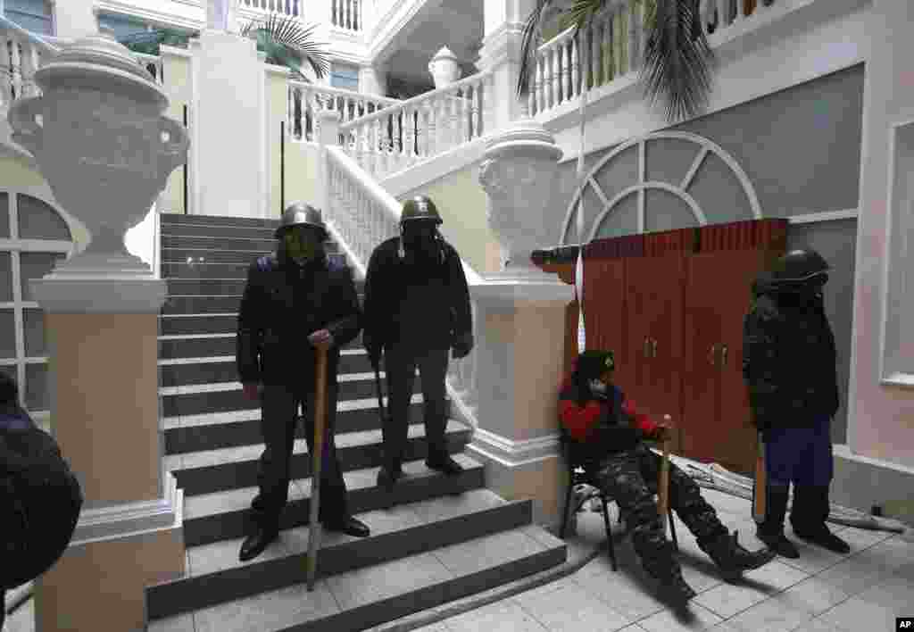 Protesters stand guard inside the Justice Ministry in central Kyiv, Jan. 27, 2014.