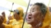 FILE - Former comfort women who served the Japanese Army as sexual slaves during World War II, at a rally before Korean Liberation Day.