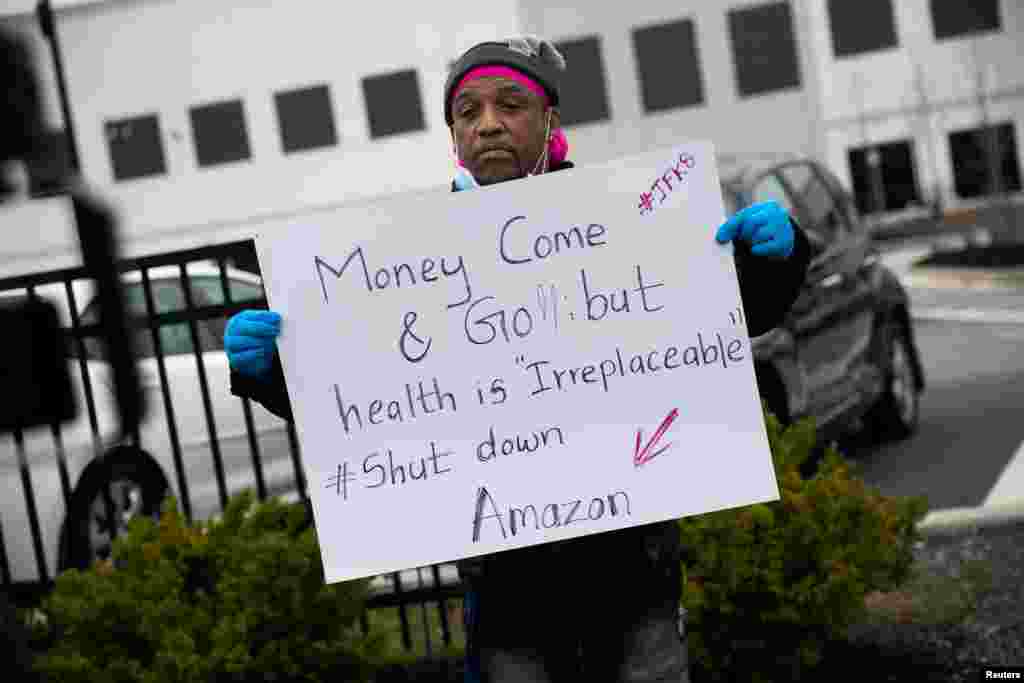 Gerald Bryson holds a sign at Amazon building during the outbreak of the coronavirus disease (COVID-19), in the Staten Island borough of New York City.