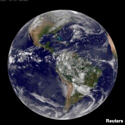 The planet Earth is seen in a photo taken by NOAA's GOES-East satellite on Earth Day, April 22, 2014. (REUTERS/NOAA/)