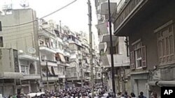 Funeral de manifestantes mortos em recontros com forças de segurança em Homs, 18 Abril de 2011l