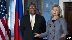 Secretary of State Clinton with Haitian Prime Minister Garry Conille in Washington, Feb. 8, 2012.