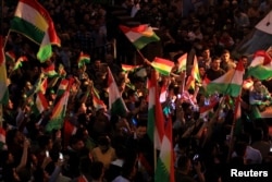 FILE - Kurds celebrate in support of the independence referendum in Duhok, Iraq, Sept. 26, 2017.