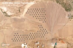 This June 4, 2021, satellite image provided by Planet Labs Inc. Experts at the James Martin Center for Nonproliferation Studies at Middlebury Institute of International Studies believe is a field of nuclear silos under construction.