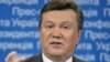 Януковича привітали з днем народження портретами Гусейна і Каддафі