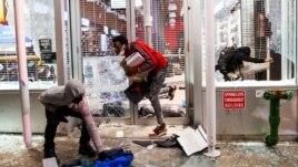 Protesters loot a store after marching against the death in Minneapolis police custody of George Floyd, in New York City, U.S., June 1, 2020. (REUTERS/Eduardo Munoz)