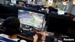 In this file image, people are seen playing online games on computers at an internet cafe in Beijing, China August 31, 2021. (REUTERS/Florence Lo)