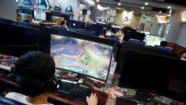 In this file image, people are seen playing online games on computers at an internet cafe in Beijing, China August 31, 2021. (REUTERS/Florence Lo)