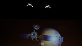 A artist rendering of the Schiaparelli Space Module and of the planet Mars is displayed on a movie screen, during an event on the occasion of the insertion of the Trace Gas Orbiter into orbit around Mars.