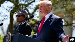 President Donald Trump gestures during a news conference with President Muhammadu Buhari in the Rose Garden of the White House, April 30, 2018, in Washington. 