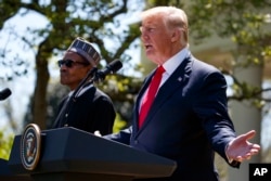 President Donald Trump gestures during a news conference with President Muhammadu Buhari in the Rose Garden of the White House, April 30, 2018, in Washington.