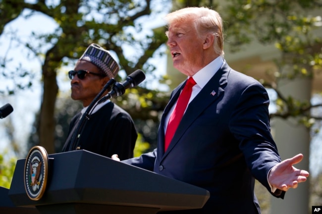 President Donald Trump gestures during a news conference with President Muhammadu Buhari in the Rose Garden of the White House, April 30, 2018, in Washington.