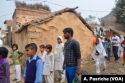 There is excitement in Patuka village in Haryana state as a man heads out to put nameplates with daughters' names on several homes.