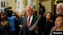 FILE - U.S. House Minority Whip Steny Hoyer is seen speaking to the media at the Capitol in Washington.