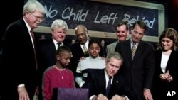 President George W. Bush signs the federal education bill, No Child Left Behind, at Hamilton High School in Hamilton, Ohio in 2002