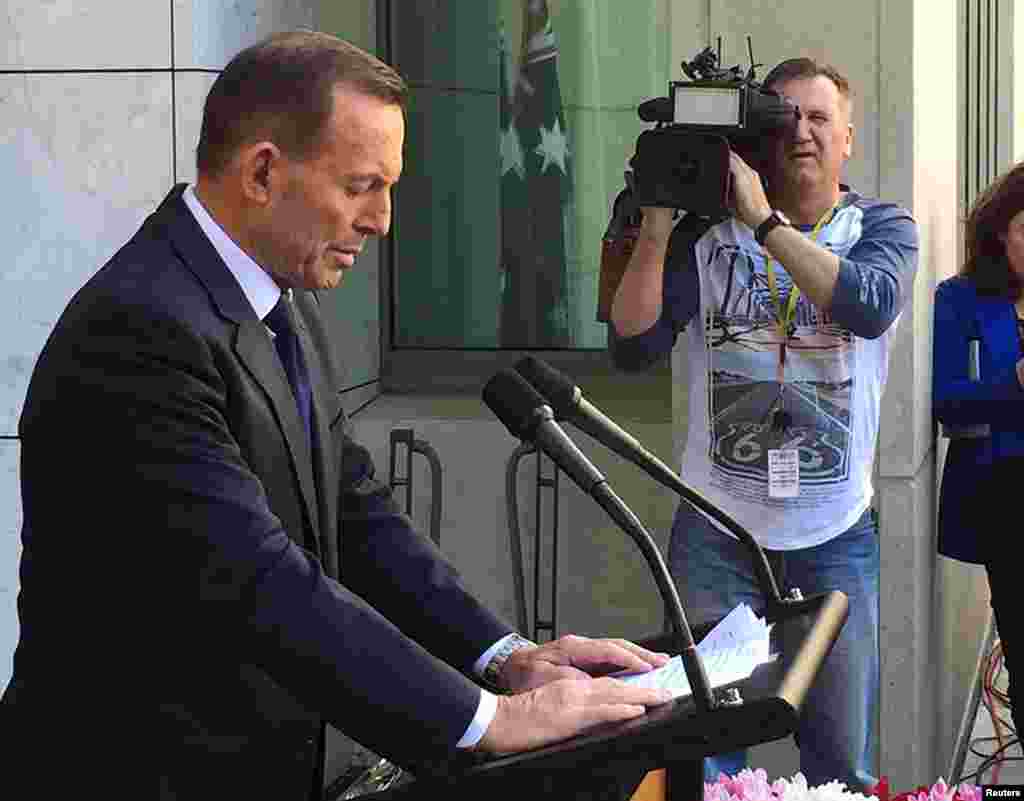 Former Australian Prime Minister Tony Abbott speaks to the media at Parliament House in Canberra, Sept. 15, 2015. 