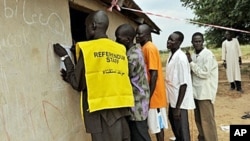 Residents of the remote south central Southern Sudan village of Nyal line up to register their names at a local school being used as a voter registration office, 15 Nov 2010. (file photo)